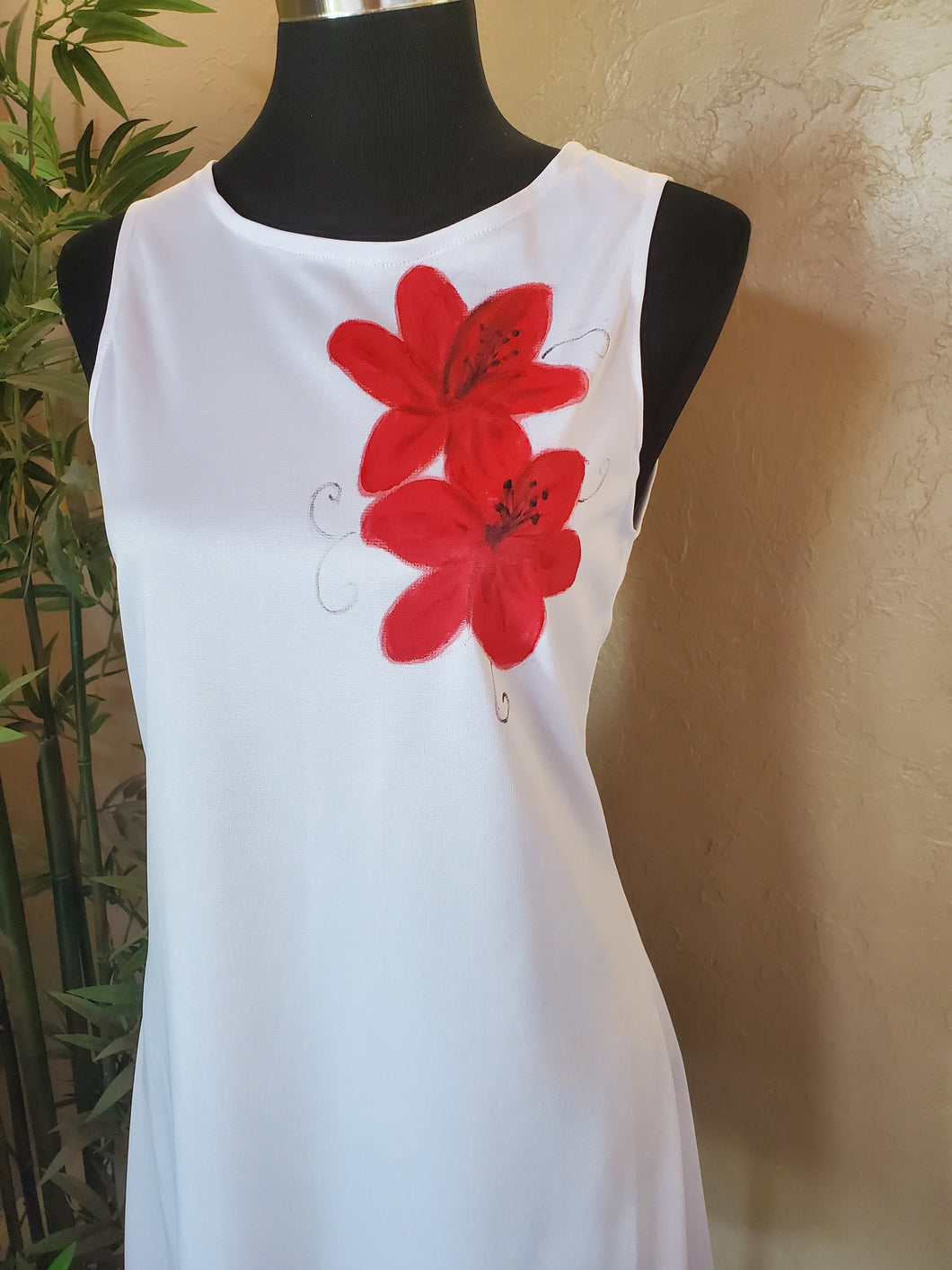 Red flowers on white dress